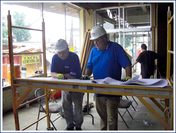 Bill Di Santo (right) overseeing a design-build project for Englewood Construction. Working with design-build GCs is a good resolution for 2011.